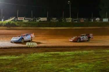 Cooper Twiggs of Murphy (left, No. 100) and Spanky Barnett of Blue Ridge, Ga. (right, No. 27) take laps during the race at Tri-County Racetrack on June 6. 