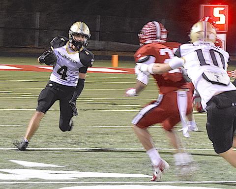 Gary Corsair • Clay County Progress Hayesville's Ben Bethel, No. 4, heads for a first down on one of six receptions he made against East Wilkes.