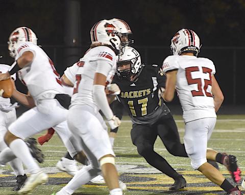 Gary Corsair • Clay County Progress Yellow Jackets defensive end Johan Webb, No, 17, powers his way between two Andrews blockers to break up a running play.