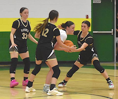 Gary Corsair • Clay County Progress Hayesville defenders Jasmine Brooks, No. 33, Olivia Free, No. 12, and Micalynn Moore, No. 10, make life difficult for a Bobcat.