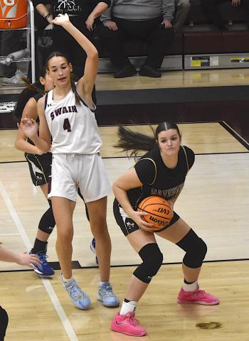 Gary Corsair • Clay County Progress Kayla Brown, No. 25, protects the rock after grabbing an offensive rebound at Swain County. 