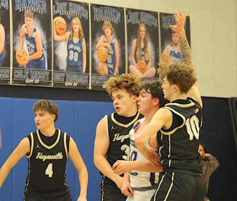 Neal Wachob • Clay County Progress Jackson Sellers, No. 33, and Brendan Lynch, No. 10, apply a Hayesville denial sandwich to Nantahala's center while Daemien Soto, No. 4, eyeballs the ball.