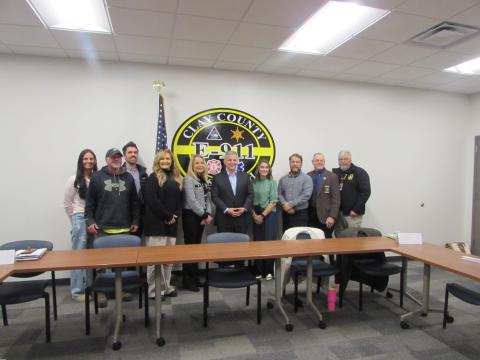 Lorraine Bennett • Clay County Progress From left, Chassidy Oakes, Todd Oakes, addiction specialist Dr. Travis Williams; Stacie Ledford of Rock Bottom Recovery; Clay County Manager Debbie Mauney; Gov. Josh Stein; Health Director Clarissa Rogers; Todd Goins of the Department of Social Services; Sheriff Mark Buchanan and EMS Director Jeff Ledford at the 911 Dispatch Center on Courthouse Drive. Stein learned how the county is using its $1 million in opioid settlement funds.