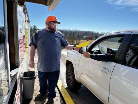 Deby Jo Ferguson •Clay County Progress Clay County Landfill worker Justin Sneed hands out flyers with information regarding permit applications and rules that come along with the permits.