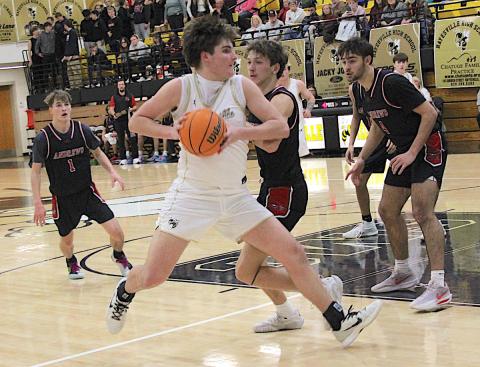 Neal Wachob • Clay County Progress Yellow Jacket big Damien Soto, No. 4, pivots as he powers his way to the basket for two of his team-high16 points against Andrews.