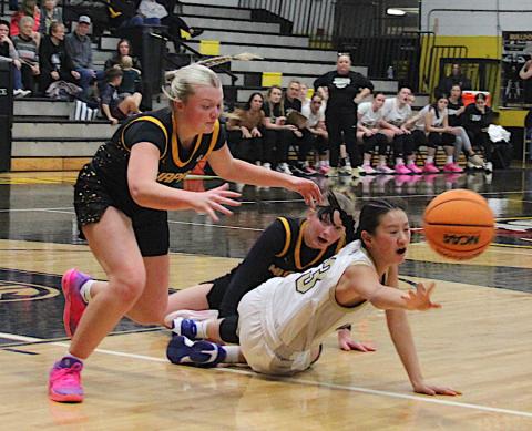 Neal Wachob • Clay County Progress Lucy Trout, No. 3, hits the floor in an attempt to save the ball for Hayesville.