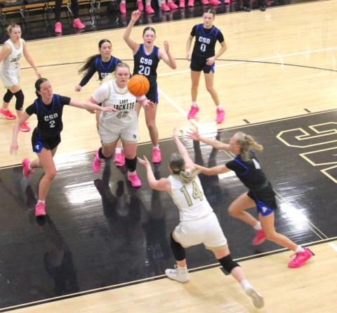 Neal Wachob • Clay County Progress Lady Yellow Jackets Ava Moore, No. 42, and Briley Clampitt, No. 14, fight to gain possession of a missed shot.