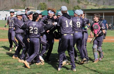 Neal Wachob • Clay County Progress Hayesville's Jackson Sellers is mobbed by teammates as he returns to the dugout after blasting a fence-clearing dinger at Robbinsville on Friday.