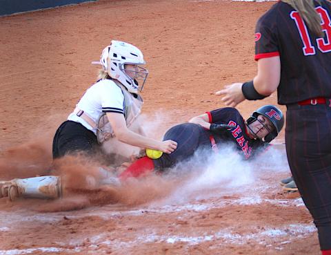 Neal Wachob • Clay County Progress Hayesville catcher Caroline Wade reaches for the softball during a home-plate collision with a Pisgah Bear.