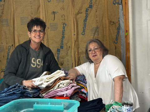 Lorrie Ross • Clay County Progress Volunteer Kim Odom, on left, enjoys sorting childrens' clothes with Pam Storring, another volunteer. The Allens welcome anyone who wants to volunteer. Odom said they are such great people to volunteer with, she drives from south of Blairsville to help. 