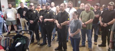 Deputies receive challenge coins from Henry Mitchell, Special Assistant to Congressman Chuck Edwards.