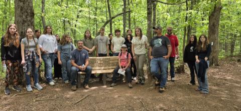 From left, Sophie Sommer, Hannah Bradshaw, Amelia Manning, Madalynn Nemkovich, Karla Slade, Bailey Reeves, Hailey Mulkey, Teacher Silas Brown, Eli White, Layne Ledford, Axel Alburto, Kaden Ledford, Joanna Atkisson, Jacob Lee, Ephraim Jones, Maggie McClure, Tony Ward, Tyler Osborn, Alexis Spain and Erica Dockery spent the day learning about the history of the trail system and plants growing there.
