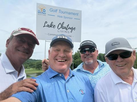 Golf Team members, from left, Lew Smither, Frank Kulbertis, Bob Britton and Alan Link participate in tournament.