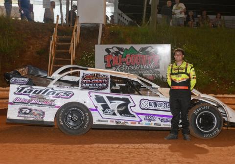 Tucker Anderson is all smiles in victory lane following his main event win.