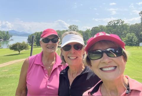 From left, golfers Linda Miles, Judy Aube and Linda Robinson take a break from the heat.