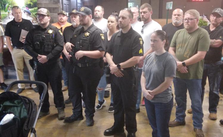 Deputies receive challenge coins from Henry Mitchell, Special Assistant to Congressman Chuck Edwards.