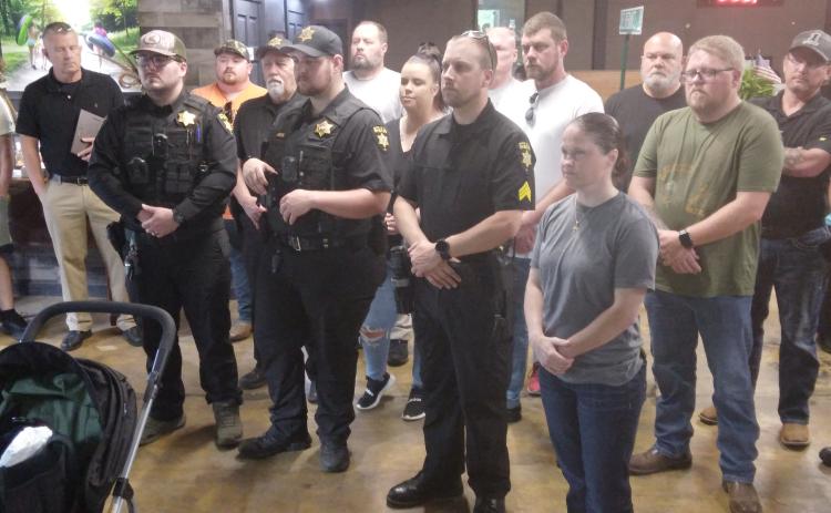Deputies receive challenge coins from Henry Mitchell, Special Assistant to Congressman Chuck Edwards.