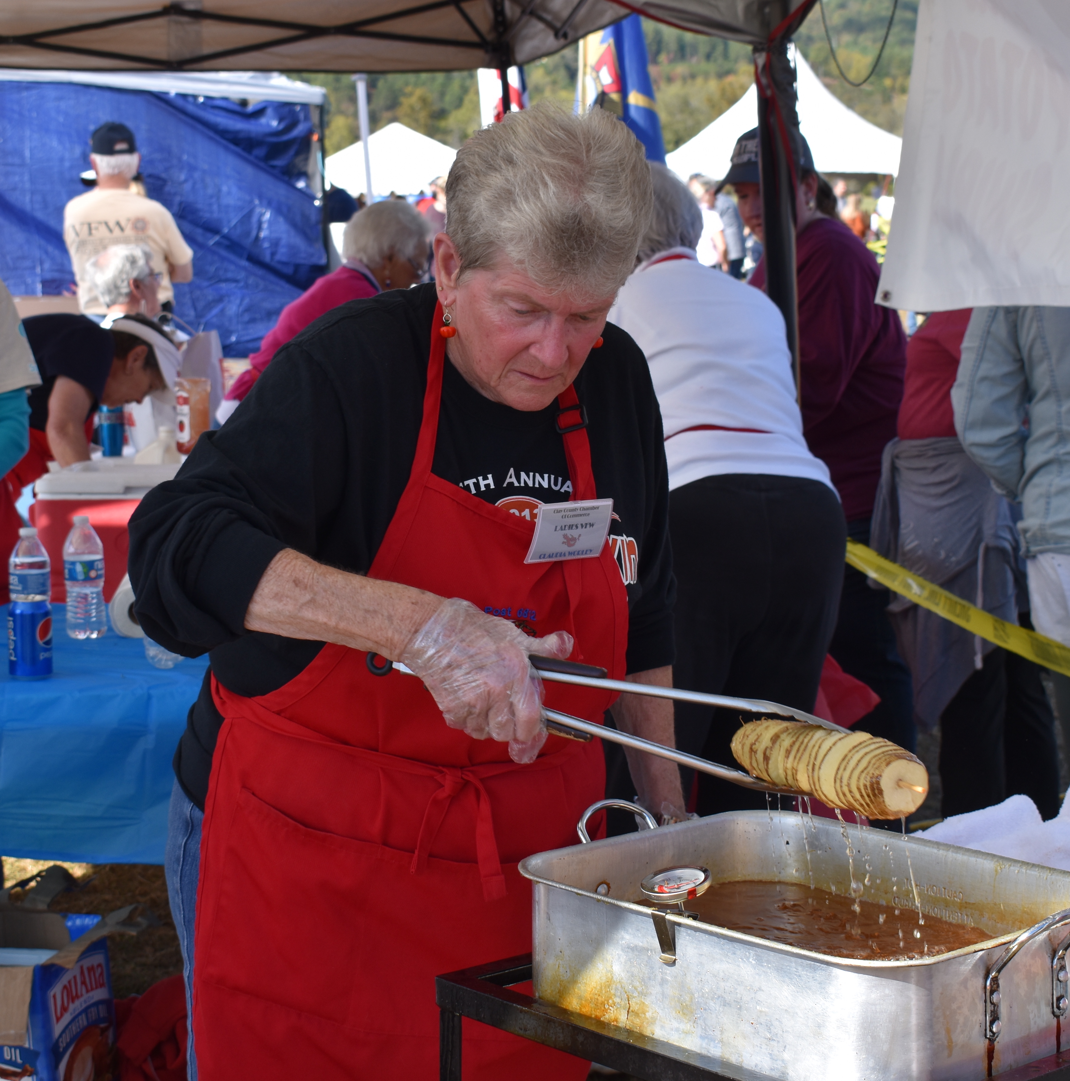 VFW Auxiliary member Claudia Worley gets ready o serve up on of the group's ever-popular fried spiral potatoes.