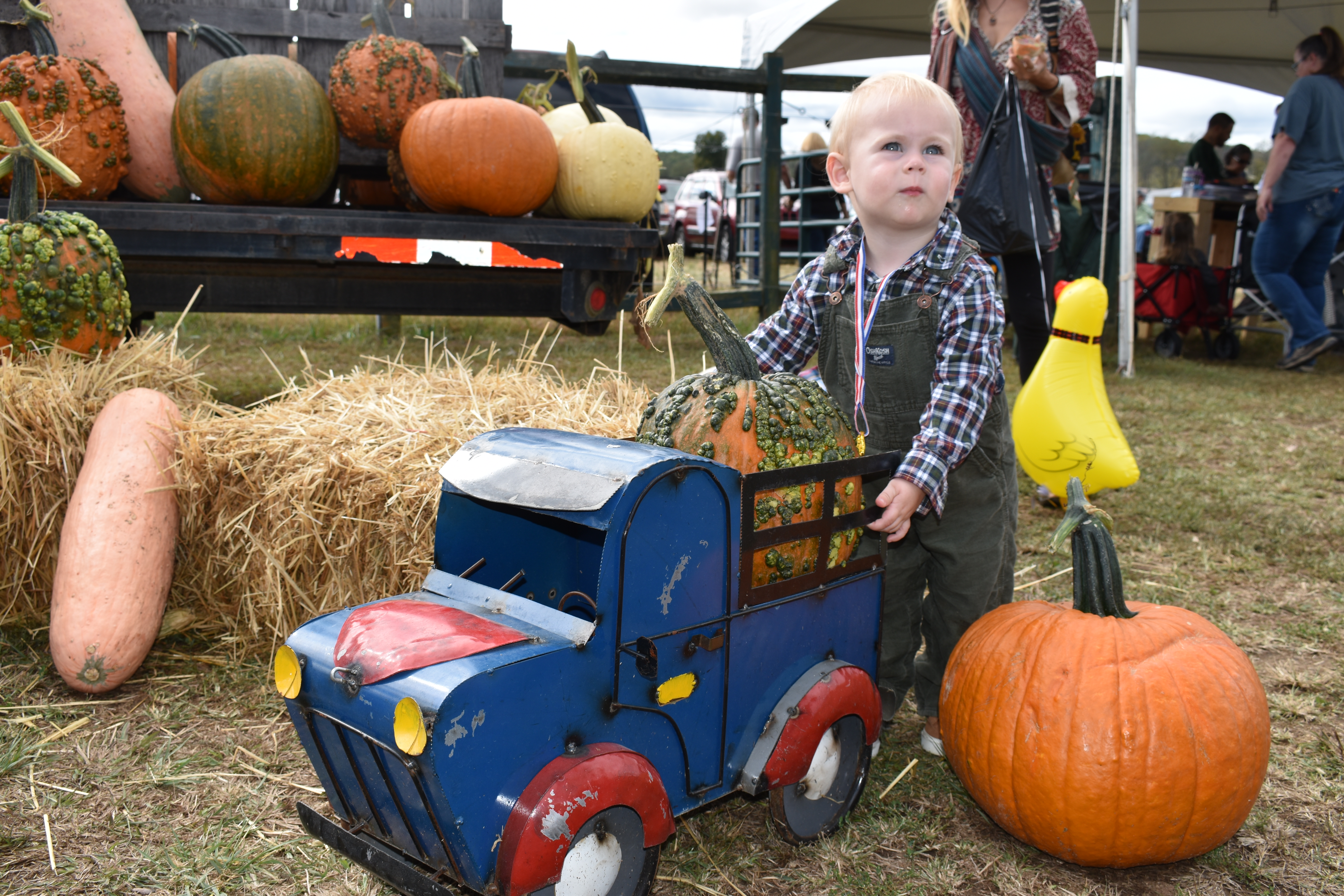 Miles Green, 1 year old from Blairsville, found an interesting spot at the entrance to the Punkin Chunkin.