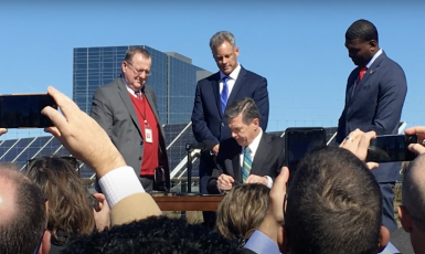 Gov. Roy Cooper signing Executive Order 80 in 2018 that, among other directives, required the N.C. Department of Transportation to develop a ZEV Plan for the state. (Photo from ncdot.gov.)