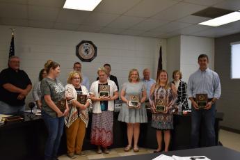 Marcia Barnes  • Clay County Progress Teachers of the Year  were recognized by the Clay County Board of Education at the May 23, 2022 board meeting. They are, front, from left, Courtenay Sumpter, Teresa Ashe, Bonnie Kelly, Sharon Perry, Ginger Scerri and Silas Brown. Back, from left, school board members’ Danny Jones, Kelly Crawford, Jason Shook, Superintendent Dale Cole, Robert Caldwell and Reba Beck congratulate the teachers.