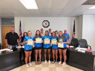 Ladies Field and Track Team awards were presented at the June 27 Clay County School Board of Education meeting, front, from left, Emma Shook, Lily Trout, Marley Espinal, Alyssa Rodd and Lila Roberts, back Danny Jones, Kelly Crawford, Jason Shook, Dale Cole, Reba Beck and Robert Caldwell.