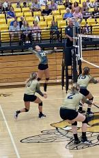 Chad Stack • Clay County Progress No. 22 Senior Katie Pierce with a big Spike at the net.
