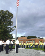 Deby Jo Ferguson • Clay County Progress The American Legion salutes while the school band performs during the raising of the flag, at the site designated to the memory of band director Jennifer Gibson.