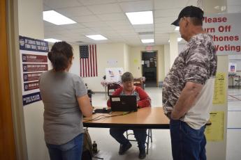 Deby Jo Ferguson • Clay County Progress Election Board worker Benita England mans the registration desk during Friday’s early one-stop voting at the Board of Elections office in Hayesville where voting has been steady.
