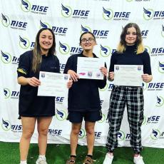 From left, Lilli Denton, Amyna Denton and Riley Denton makes history for Hayesville High School at the state level.