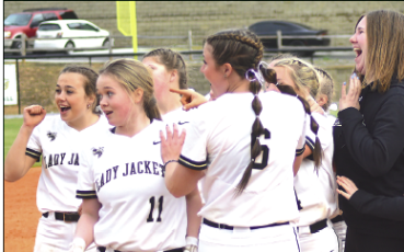 Hayesville’s girls gleefully react to seeing the boys baseball team running toward them with whooping and hollering after the Lady Yellow Jackets came from behind to beat Andrews, 7-6, in extra innings.