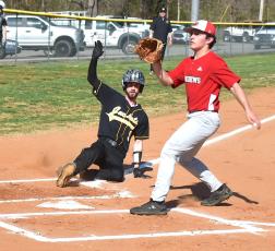 Gary Corsair • Clay County Progress Cade Denton slides home with Hayesville's fourth in the Yellow Jackets 24-0 shellacking of Andrews on Monday. 