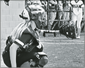 Caroline Wade is behind the plate for the HMS Lady Jackets.