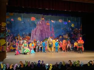 Little Mermaid cast from left: Kitty Kelly, Gracie Miller, Kaylee Hamilton, Lilly Martin, Gemma Lawrence, Violet Faulk, Eli George, Arlen Myers, Olivia Petty, Natalie George, Logan Kelly, Gracey Rodriquez, Darby Lawrence, Emma Rhodes, Lucy Hopple, Isla Hatfield, Maddy Goddard, Miles Collum, Pella Fuerch and Lincoln Carpenter.