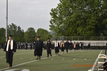 Midge Roach • Clay County Progress The Hayesville High School Class of 2023 enters the Frank R. Long Memorial Stadium for commencement.