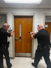 School Resource Officers Chris Harper and Donovan Byers participate in rapid deployment exercises.