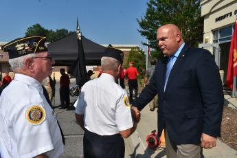 Becky Long • Clay County Progress Clay County Chief Deputy Todd Wingate shakes hands with an American Legion member after the memorial service.