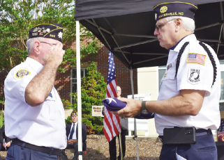 Becky Long • Clay County Progress American Legion member Mitchell Shields salutes after he and Phil Cantley conclude the flag folding ceremony during the remembrance program for the nearly 3,000 people who lost their lives 22 years ago in the 911 terrorists attacks.