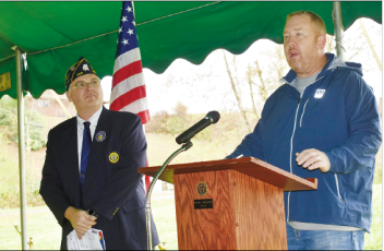 American Legion Post 532 Commander Robert Seibert listens as County Commission Chairman Rob Peck talks about the future Veterans Memorial Park.