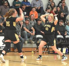 Gary Corsair • Clay County Progress Mallory Peck, No. 45, and Brooke Graves, No. 40, celebrate with a high five after Hayesville’s thrilling come-from-behind 48-47 over-time victory over Robbinsville on Friday.