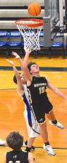 Gary Corsair • Clay County Progress Hayesville's Landon Trout, No. 15, goes up strong for 2 points against Hiwassee Dam.