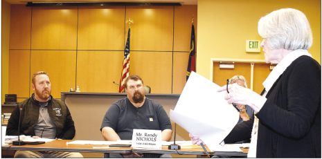 Becky Long • Clay County Progress Commission Chairman Rob Peck, Vice-Chair Randy Nichols and Commissioner Dwight Penland follow along with County Attorney Merinda Woody as she outlines, and recommends, right of way agreements between the county and N.C. Department of Transportation.