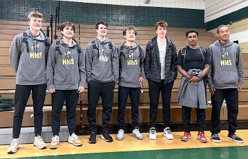 Photo by Beth Chandler Hayesville's seniors, from left, Isaac Chandler, Zach Townsend, Jacob McClure, Landon Hughes, Luke Lee, Asher Brown, and Shawn Plummer pose before taking the court at Eastern Randolph.