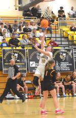 Bryleigh Krieger, No. 10, slips past a Murphy defender for a crucial basket in Hayesville's thrilling victory over the Bulldogs.