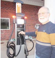 Mayor Joe Slaton shows off new EV charging station behind Town Hall.