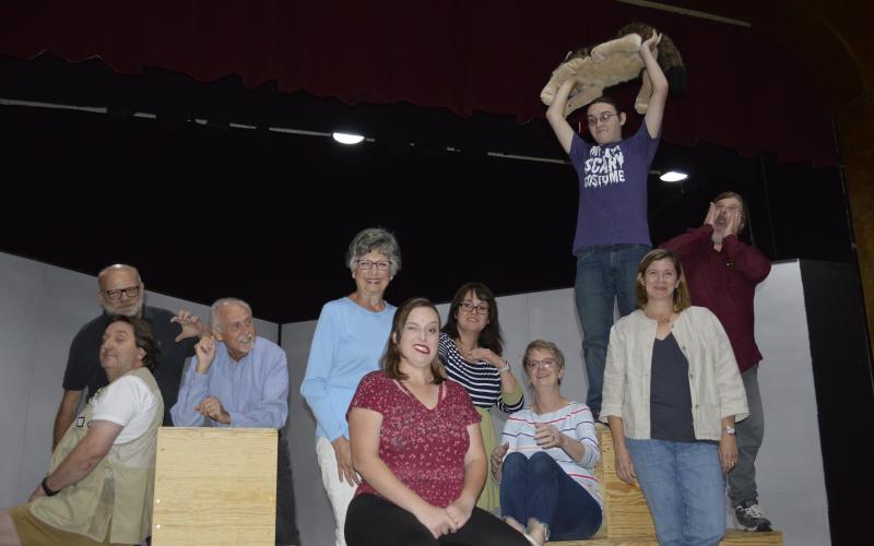 “Curious” cast meets curious script. Front from left, Jon Jordan, Ben Stephens, BJ Foster and Abigail Jacobs. Middle, Jessica Gentry, Susan Morgan and Virginia Mattox. Back, Lamar Barber, on cube holding Wellington is Jody Hensley, far right is David Layfield. • Pam Roman • Photo submitted