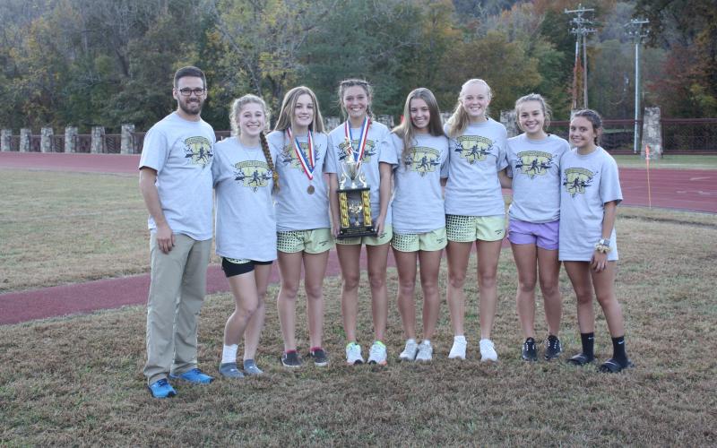 (Darleen Hatherly • Submitted)  The Lady Jackets celebrate their conference championship. From left, coach Zach Moss, Allison Thomas, Caroline Burch, Kaysen Krieger, Emily Shook, Cecelia Jones, Lila Roberts and Meadow Rose