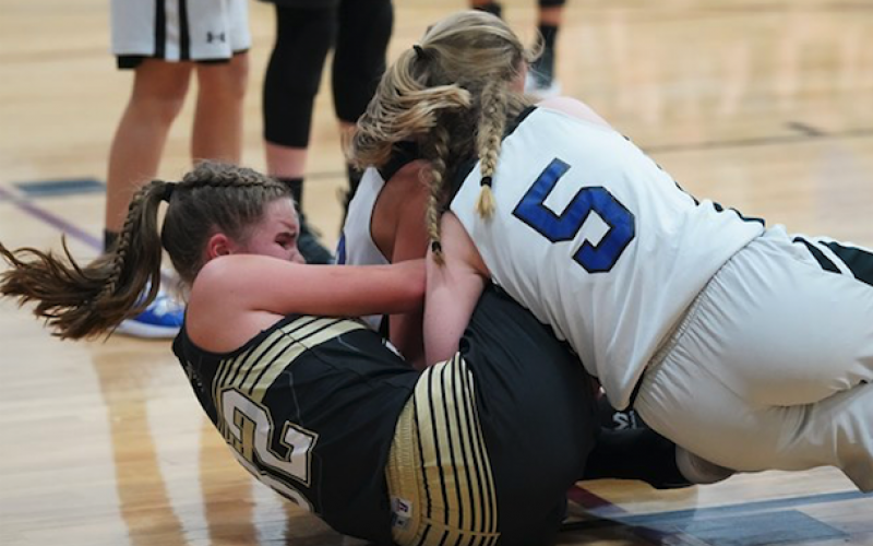(Kelli Graves • Clay County Progress) Mallory Peck fights for the ball as the Lady Jackets fight for a win.