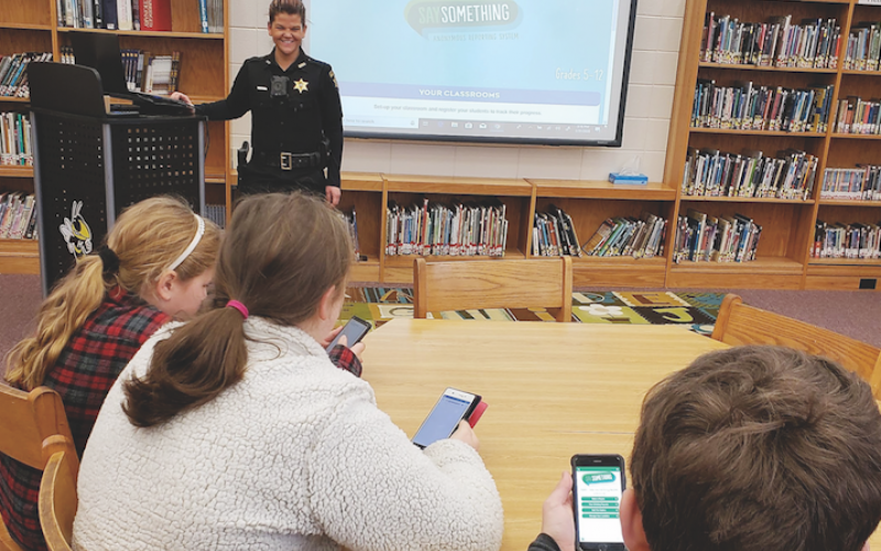 Clay County Sheriff’s Office School Resource Officer and District Training Coordinator Melissa Mariano trained Clay County Schools students about the Say Something Anonymous Reporting App. The student in the foreground has the app open on his phone.