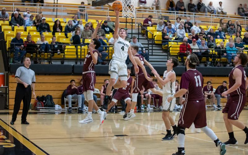 (Kelli Graves • Clay County Progress) Hayesville’s Hayden McClure takes to the air for the score. McClure caused trouble for Swain on both ends of the court. 